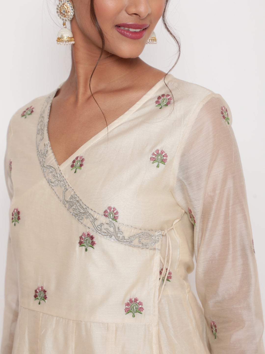Woman posing in Savi's Silk Chanderi Ethnic Motif Embroidered Off White Angrakha Kurta