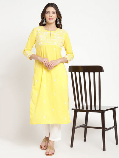 Woman wearing Savi's yellow cotton Kurta. 