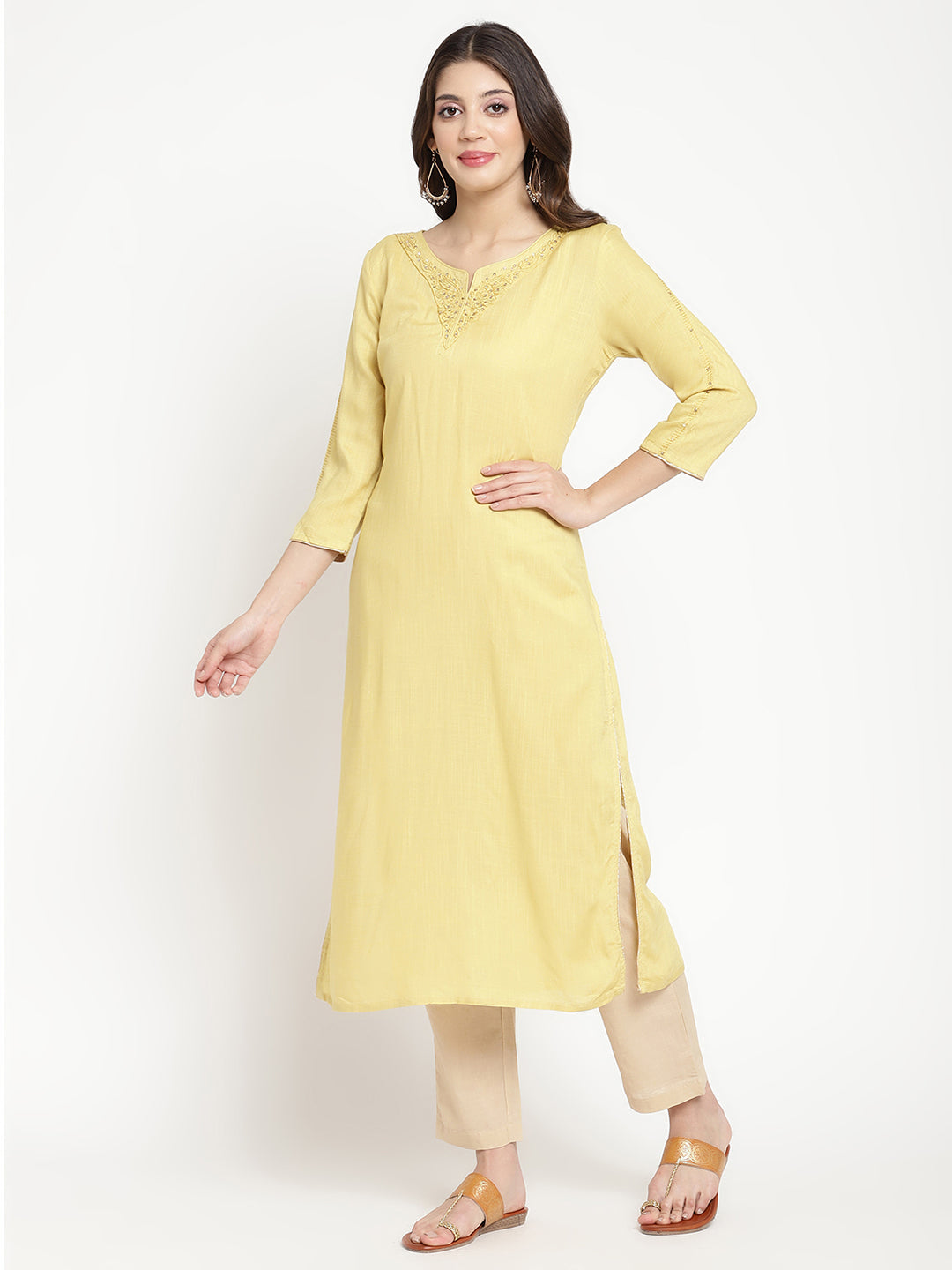 Woman wearing a yellow rayon, straight-fit Kurta.