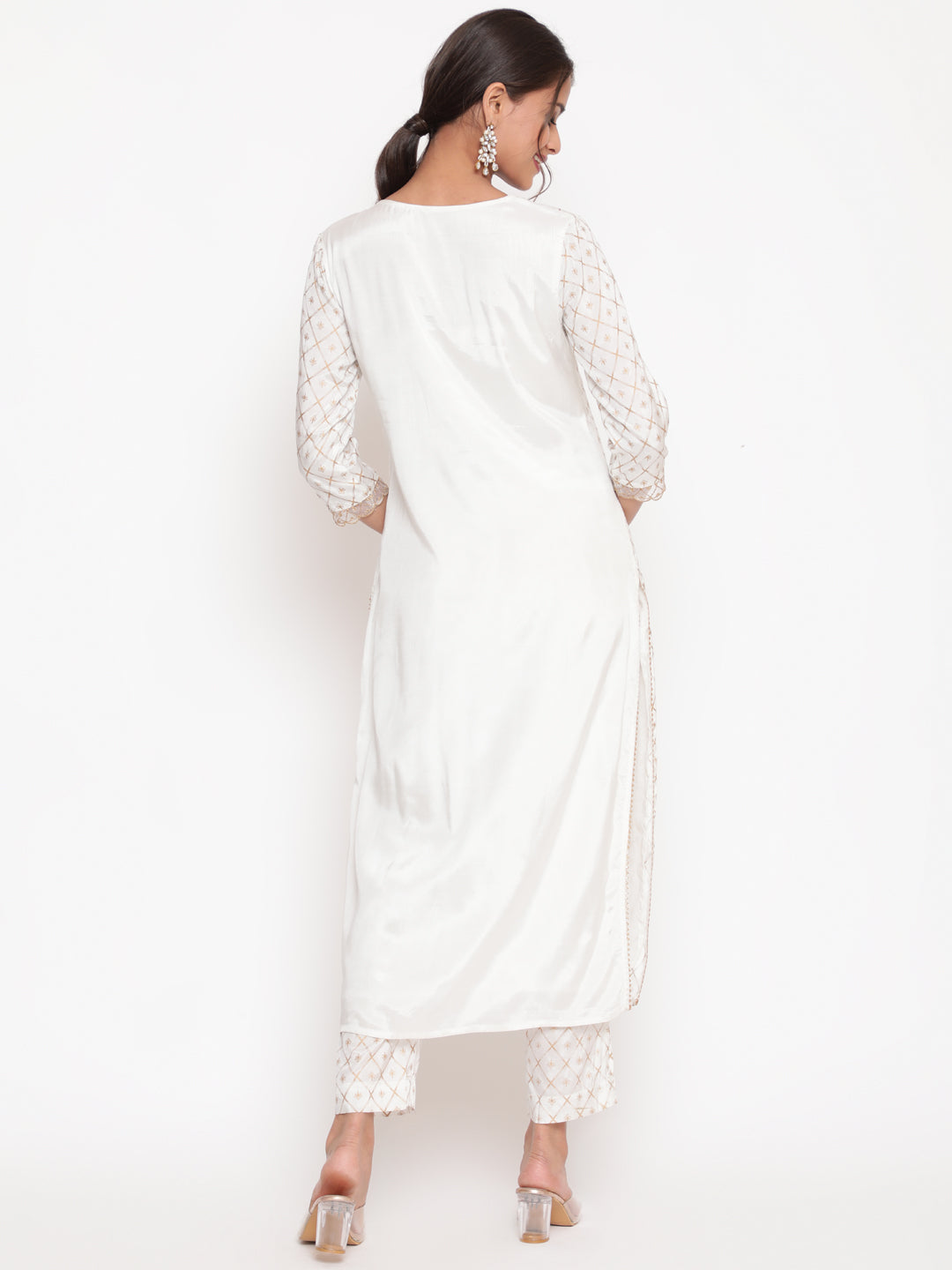 Woman posing in Savi’s Shantoon Printed and Embroidered Off White Kurta Pant Set